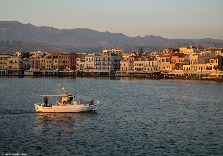 Fishing boat leaving Chania harbour at sunrise - click on the image to enlarge Fishing boat leaving Chania harbour at sunrise - click on the image to enlarge