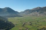 The plateau of Askyfou looking South. The photo was taken along the road that comes from Vrysees as it descends towards the plateau. The green fields and bare trees indicate that it was taken in winter or early spring