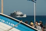 People waiting for the ferryboat Daskalogiannis in Agia Roumeli. The ferry is arriving from Loutro on a stormy day