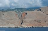 The sharp cut of the gorge of Aradena and Marmara (buildings by the coast) seen from the sea